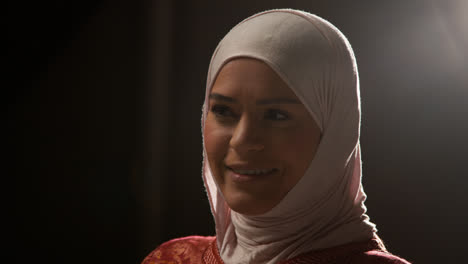 Studio-Head-And-Shoulders-Portrait-Of-Smiling-Muslim-Woman-Wearing-Hijab-2